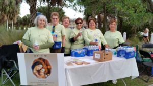 Mary Woltman, Patricia Hanson, Beth Aubin, Cathy Pena, Gail Merrill Rose Marie Varas supporting Bridging Freedom Event at DCCW Table